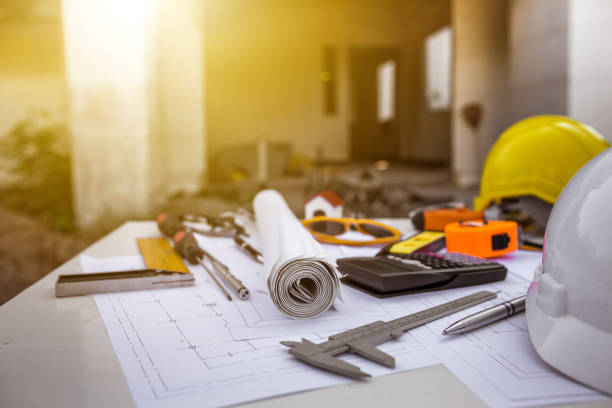 Detailed architectural blueprint and drawing tools used by general contractors in Oakland, CA for remodeling projects