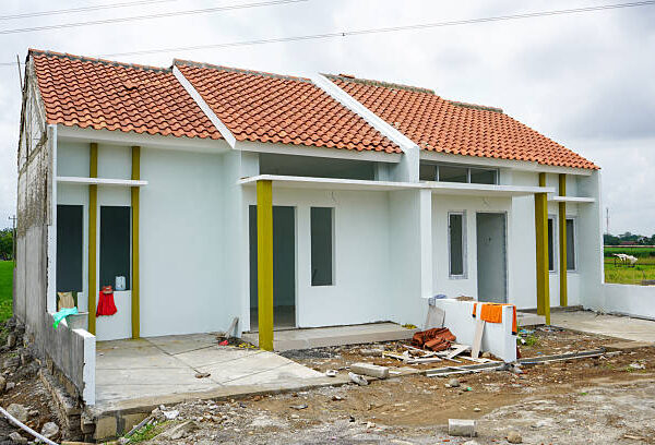A house being built with a tiled roof, representing modern living spaces in progress.