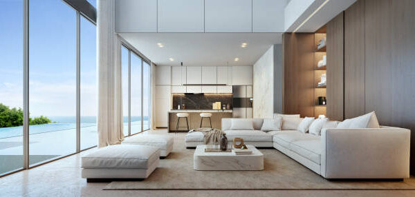A contemporary living room design with a plush couch and an elegant fireplace, emphasizing modern aesthetics.